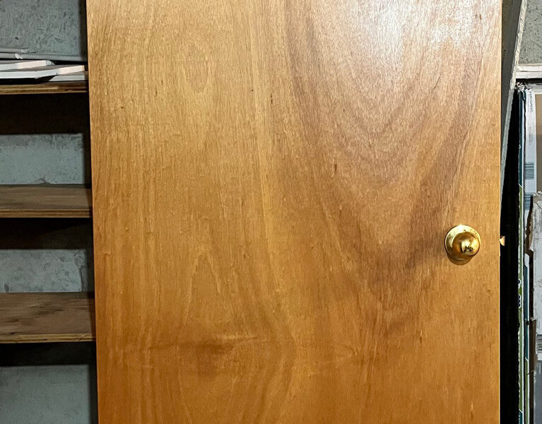 Hardwood door with handle and trim